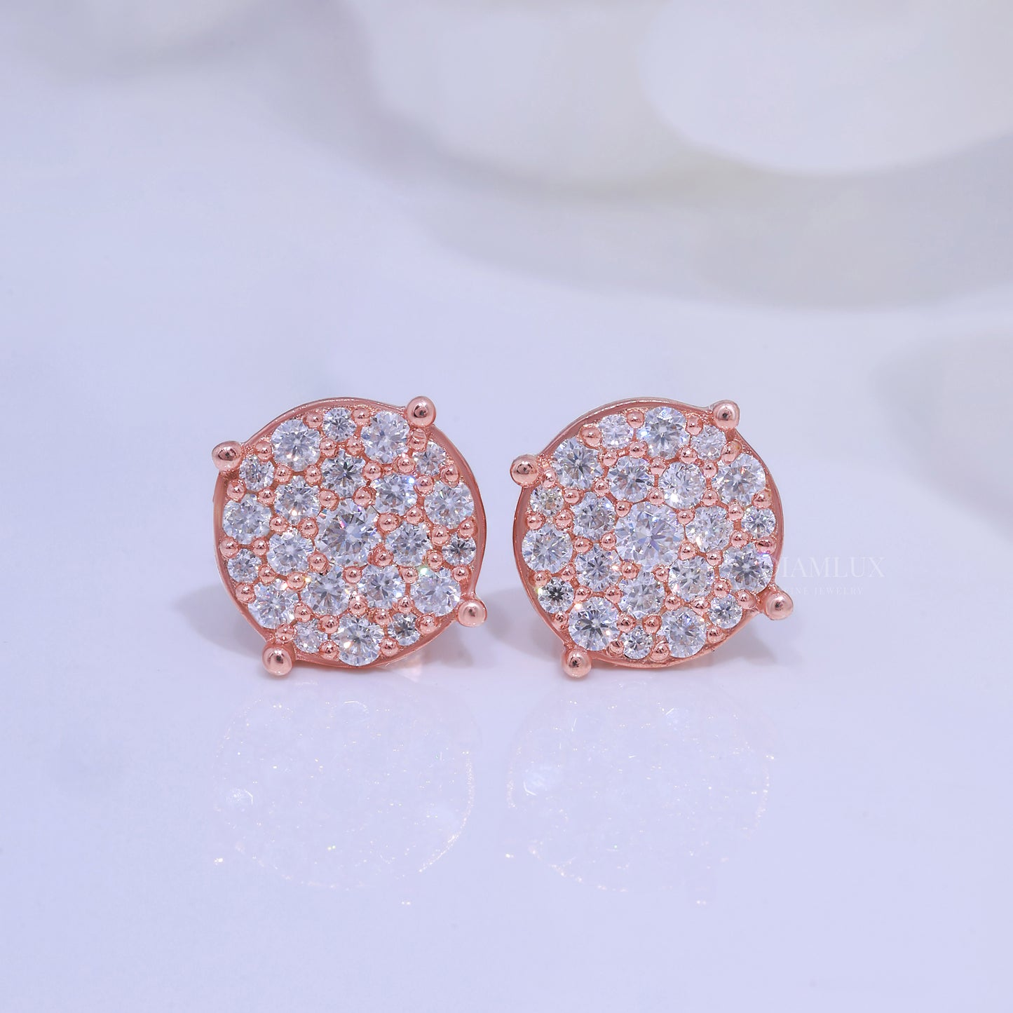 Close up of gold hoop earrings with small diamonds