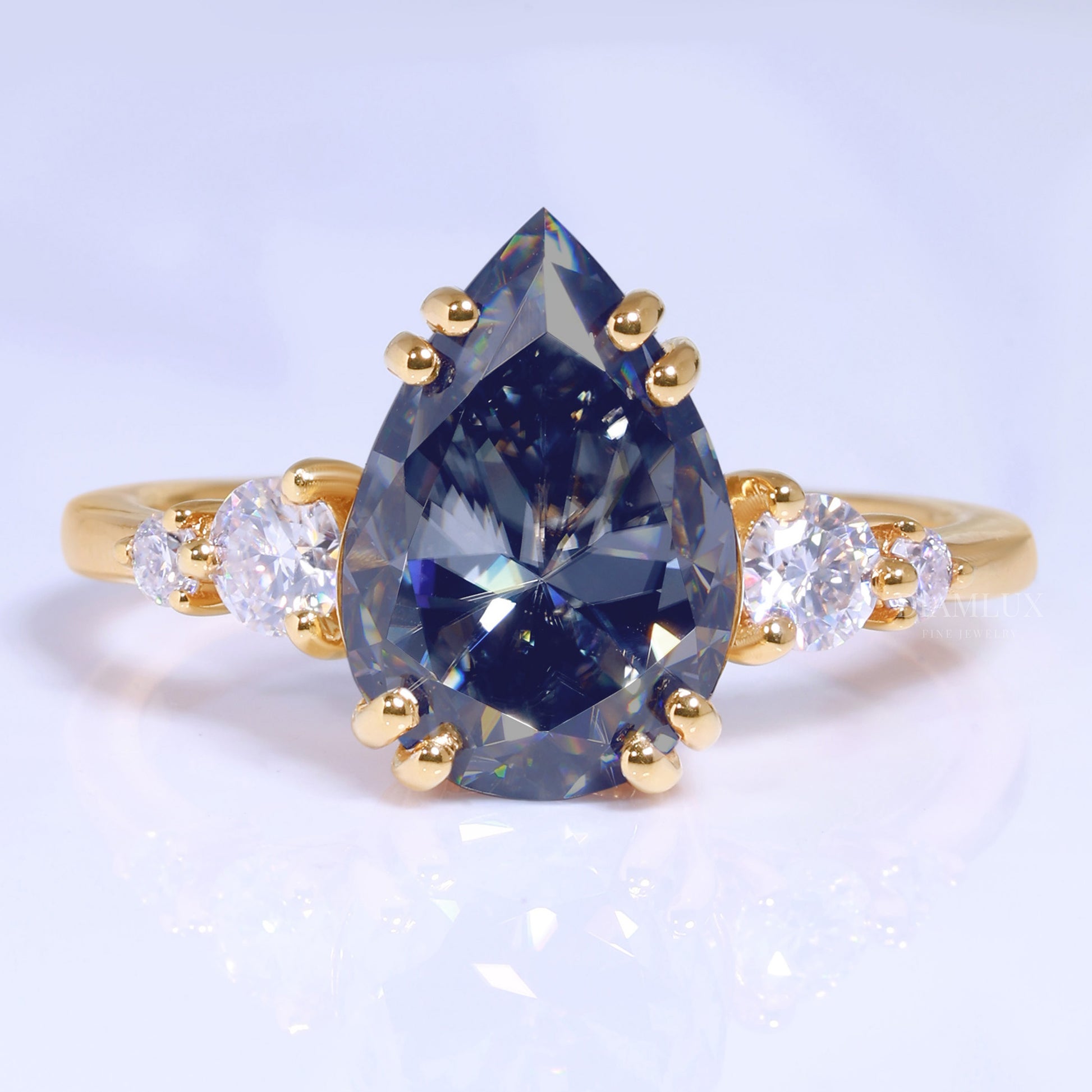 Yellow Gold Pear Shaped Dark Blue Gemstone Ring with Round Accent Stones Diamlux Fine Jewelry