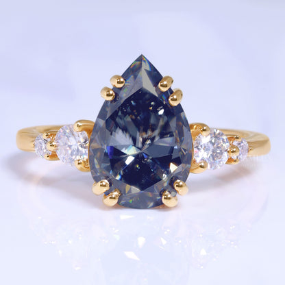 Yellow Gold Pear Shaped Dark Blue Gemstone Ring with Round Accent Stones Diamlux Fine Jewelry