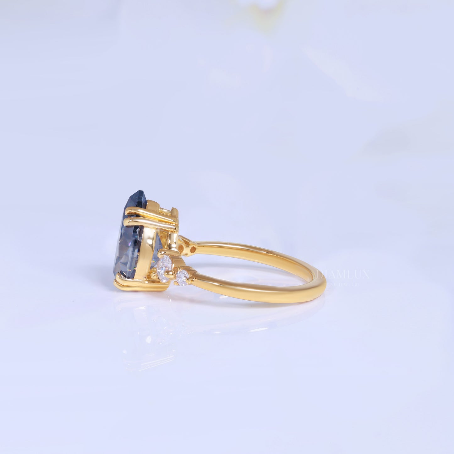 Yellow Gold Pear Shaped Dark Blue Gemstone Ring with Round Accent Stones Diamlux Fine Jewelry