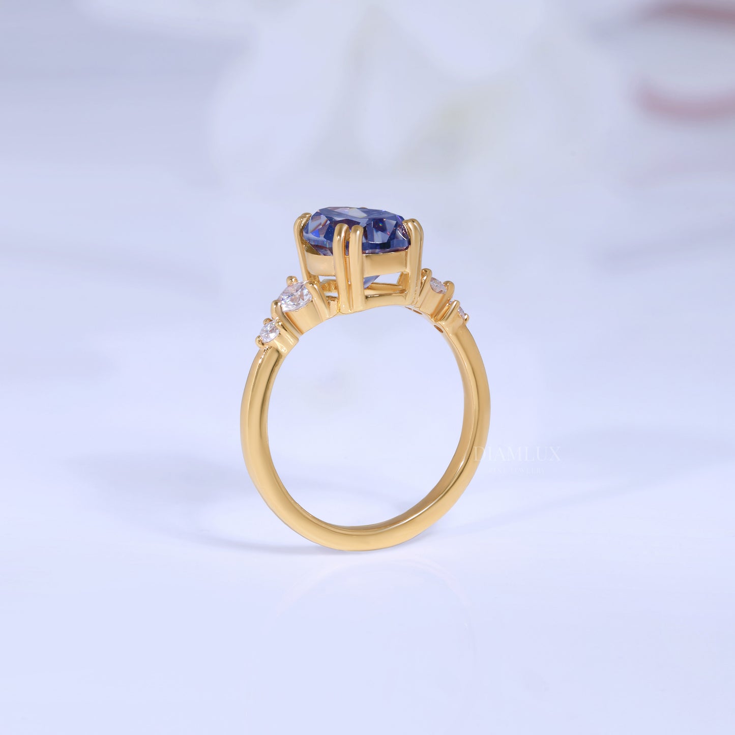 Yellow Gold Pear Shaped Dark Blue Gemstone Ring with Round Accent Stones Diamlux Fine Jewelry