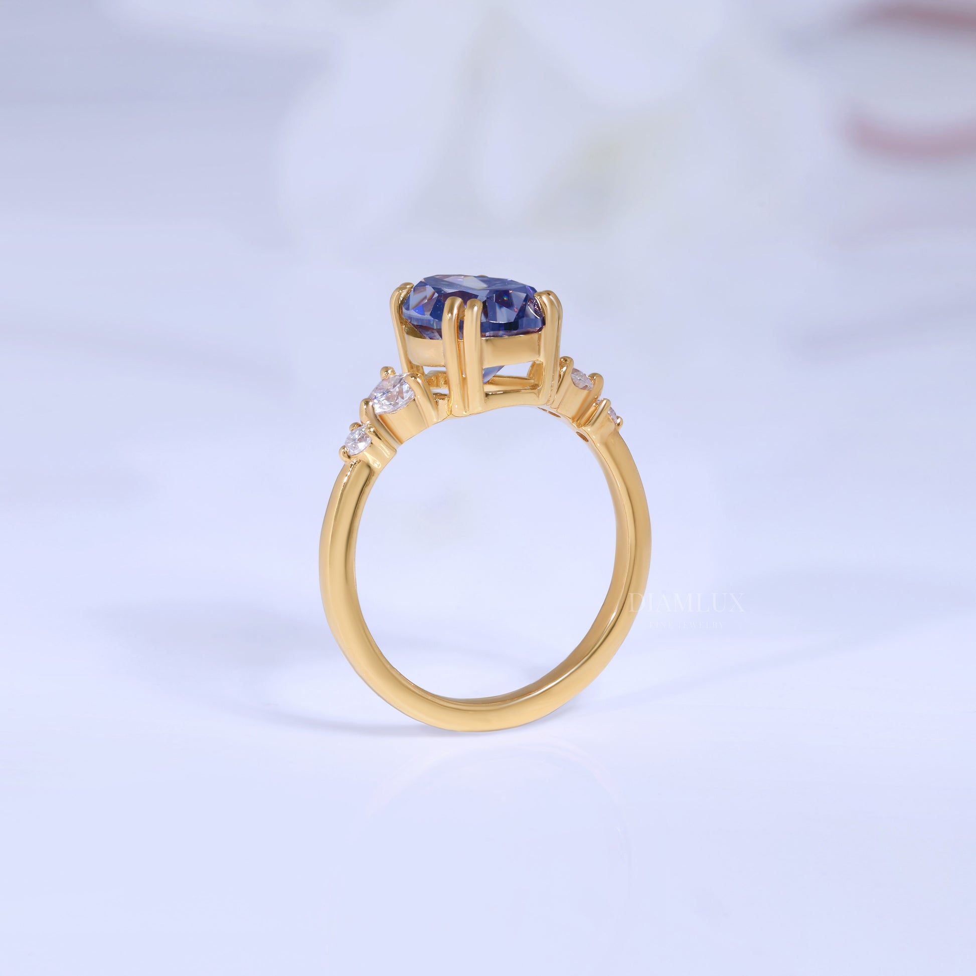 Yellow Gold Pear Shaped Dark Blue Gemstone Ring with Round Accent Stones Diamlux Fine Jewelry