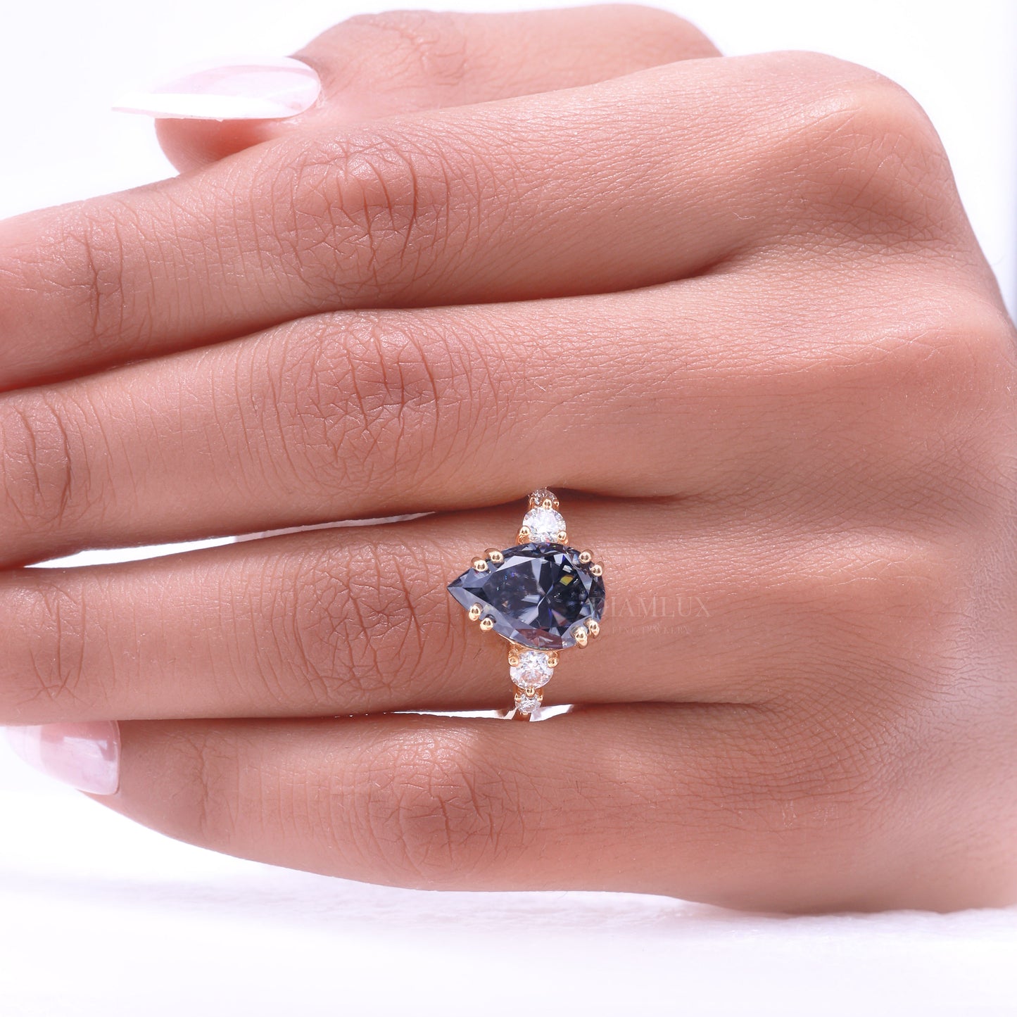 Yellow Gold Pear Shaped Dark Blue Gemstone Ring with Round Accent Stones Diamlux Fine Jewelry