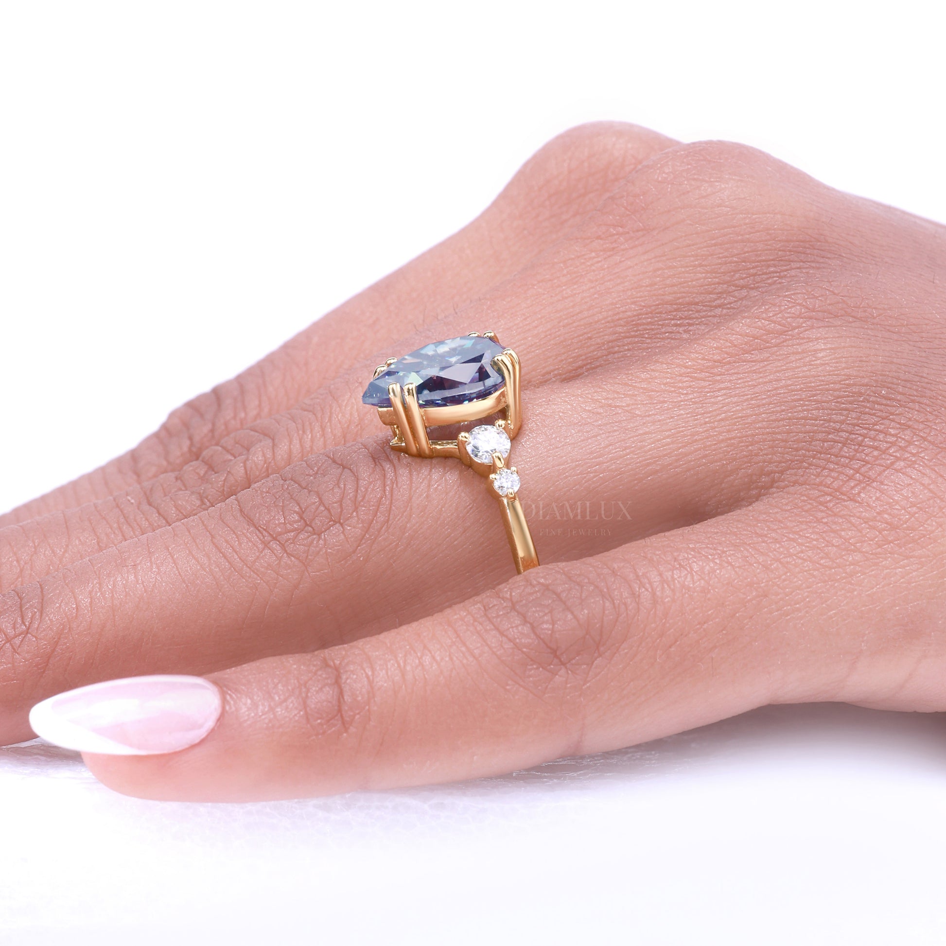 Yellow Gold Pear Shaped Dark Blue Gemstone Ring with Round Accent Stones Diamlux Fine Jewelry